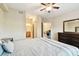 Bright main bedroom with modern decor and en suite bathroom entrance at 1231 Godavari Way # 103, Wesley Chapel, FL 33543