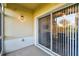Screened patio with sliding glass door to the living area at 1231 Godavari Way # 103, Wesley Chapel, FL 33543