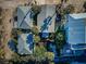 Aerial view of several rooftops surrounded by lush landscaping at 12409 Gulf Blvd, Treasure Island, FL 33706