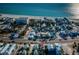 Charming neighborhood with beach access, showcasing a mix of homes and vibrant blue ocean views at 12409 Gulf Blvd, Treasure Island, FL 33706