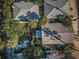 Aerial shot of several homes with trees providing plenty of shade at 12409 Gulf Blvd, Treasure Island, FL 33706