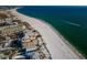 Breathtaking aerial view of the Gulf Coast, featuring a pristine white sand beach and turquoise waters at 12409 Gulf Blvd, Treasure Island, FL 33706
