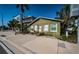 Charming cottage-style home with a quaint exterior and well-maintained surroundings in a residential neighborhood at 12409 Gulf Blvd, Treasure Island, FL 33706