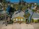 Cozy cottage-style home surrounded by lush landscaping providing a secluded and peaceful setting at 12409 Gulf Blvd, Treasure Island, FL 33706