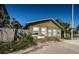 Charming cottage-style home showcasing its cozy appeal in a quiet neighborhood setting with sidewalks at 12409 Gulf Blvd, Treasure Island, FL 33706