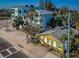 Neighborhood street featuring a mix of traditional and modern home styles with lush landscaping at 12409 Gulf Blvd, Treasure Island, FL 33706