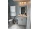 Bathroom featuring white vanity and tile floor at 12447 Drysdale St, Spring Hill, FL 34609