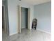 Empty bedroom with tile floor and closet at 12447 Drysdale St, Spring Hill, FL 34609