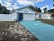 Lovely single-story house with a neatly manicured front yard and bright blue driveway at 12447 Drysdale St, Spring Hill, FL 34609