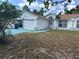 Charming single-story home with a well-maintained front yard and beautiful blue accents at 12447 Drysdale St, Spring Hill, FL 34609