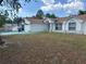 Inviting single-story home with a tidy front yard and a charming exterior facade at 12447 Drysdale St, Spring Hill, FL 34609