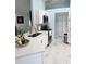 Modern kitchen features white cabinets, stainless steel appliances, and quartz countertops at 12447 Drysdale St, Spring Hill, FL 34609