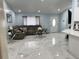 Spacious living room featuring stylish decor, marble flooring, and ample natural light at 12447 Drysdale St, Spring Hill, FL 34609