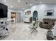 Bright living room featuring sleek marble floors and a seamless open floor plan at 12447 Drysdale St, Spring Hill, FL 34609