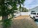 View of the side yard featuring white fencing and a well-maintained grassy area at 12447 Drysdale St, Spring Hill, FL 34609