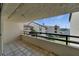 Open-air balcony boasting scenic views of lush landscaping and waterfront at 126 1St E St # 102, Tierra Verde, FL 33715