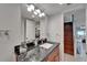 Elegant bathroom with granite countertop, sink, and decorative mirror at 126 1St E St # 102, Tierra Verde, FL 33715