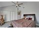 Spacious bedroom with a vaulted ceiling, plush bedding, and ample storage in the closet area at 126 1St E St # 102, Tierra Verde, FL 33715