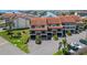 Beautiful condo building showcasing the classic architecture and well-manicured landscaping at 126 1St E St # 102, Tierra Verde, FL 33715
