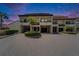Beautiful condo building showcasing the classic architecture and tropical landscaping at 126 1St E St # 102, Tierra Verde, FL 33715