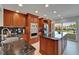 Spacious kitchen with granite countertops, stainless appliances, and a large island perfect for entertaining at 126 1St E St # 102, Tierra Verde, FL 33715