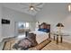 Spacious main bedroom featuring a high ceiling, a ceiling fan, and a private balcony overlooking the water at 126 1St E St # 102, Tierra Verde, FL 33715