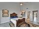 Well-appointed bedroom features a statement wall decoration and ensuite bathroom at 126 1St E St # 102, Tierra Verde, FL 33715