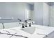 Stylish bathroom with modern black fixtures, a large mirror, and white marble counters at 14136 Payne St, Spring Hill, FL 34609