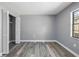 Clean bedroom showcasing wood floors, closet, and natural light from the window at 14136 Payne St, Spring Hill, FL 34609