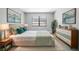 Comfortable bedroom featuring light gray walls, natural light, and stylish furnishings at 14136 Payne St, Spring Hill, FL 34609
