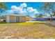 Residential home featuring a well-manicured lawn and fenced backyard at 14136 Payne St, Spring Hill, FL 34609