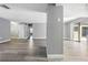 Spacious living room featuring modern gray flooring and neutral paint, with sliding glass doors at 14136 Payne St, Spring Hill, FL 34609