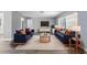 Cozy living room with contemporary decor, including comfortable seating, stylish lighting, and a large window at 14136 Payne St, Spring Hill, FL 34609