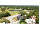 Panoramic aerial view of the property, golf course, neighborhood, and waterways at 1500 Elmwood St, Clearwater, FL 33755