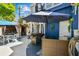 Backyard featuring outdoor kitchen with grill, and a seating area under an umbrella at 1500 Elmwood St, Clearwater, FL 33755