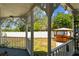 View of a backyard featuring a covered gazebo with bar seating and a white privacy fence at 1500 Elmwood St, Clearwater, FL 33755