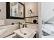 Modern bathroom featuring a unique sink with stylish fixtures, decorative tiling and a view to a luxurious tub at 1500 Elmwood St, Clearwater, FL 33755