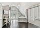 Bright bathroom boasts tiled floors, a marble encased tub, and French doors leading to an outdoor balcony at 1500 Elmwood St, Clearwater, FL 33755