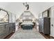 Bedroom with an exposed ceiling, hardwood floors, and gray furniture offering a cozy space at 1500 Elmwood St, Clearwater, FL 33755