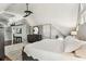 Bright bedroom with a ceiling fan, a neutral color palette, an area rug and a glimpse of outdoor scenery at 1500 Elmwood St, Clearwater, FL 33755