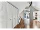 Expansive bonus room features wood-look floors, a double-door closet and access to other areas of the house at 1500 Elmwood St, Clearwater, FL 33755