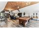 Versatile bonus room features a pool table, desk space, and relaxing lounge area for entertainment and leisure at 1500 Elmwood St, Clearwater, FL 33755