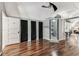 Large bonus room with wood-look floors, ample storage and a glass shower at 1500 Elmwood St, Clearwater, FL 33755
