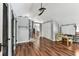 Large bonus room with wood floors, a ceiling fan and plenty of space for a variety of uses at 1500 Elmwood St, Clearwater, FL 33755