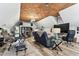 The bonus room has a large work area, media center, seating area, and unique ceiling at 1500 Elmwood St, Clearwater, FL 33755