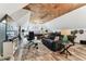 Large bonus room offers flexible living with a comfortable sofa, desk, billiard table and great natural light at 1500 Elmwood St, Clearwater, FL 33755