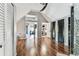 Open floorplan bonus room featuring wood-look floors and access to other rooms of the house at 1500 Elmwood St, Clearwater, FL 33755