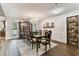 Elegant dining room featuring a chandelier, wood floors, and a large china cabinet at 1500 Elmwood St, Clearwater, FL 33755