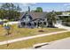 Charming two-story Victorian home with a wrap-around porch and well-manicured lawn at 1500 Elmwood St, Clearwater, FL 33755