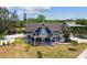 Lovely Victorian home with blue siding, white trim, inviting porch and two-car garage at 1500 Elmwood St, Clearwater, FL 33755